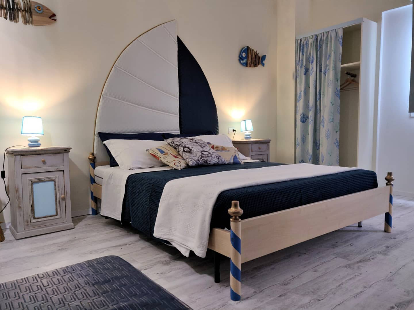 Adriatica room — bed with sail-shaped headboard